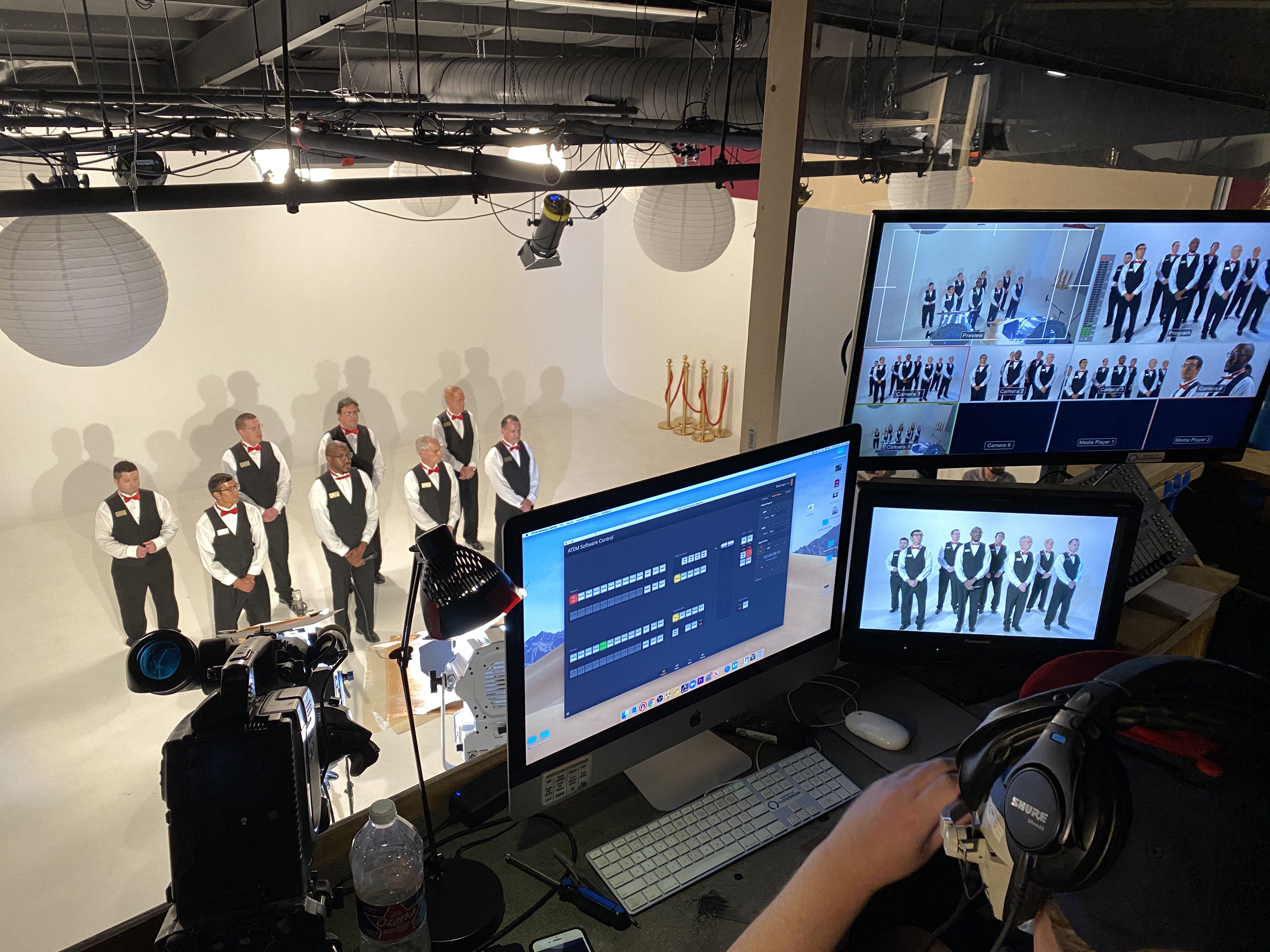 Cloudbreak Creative multi-camera production setup with live switching, audio monitoring, and a vocal group being filmed on stage